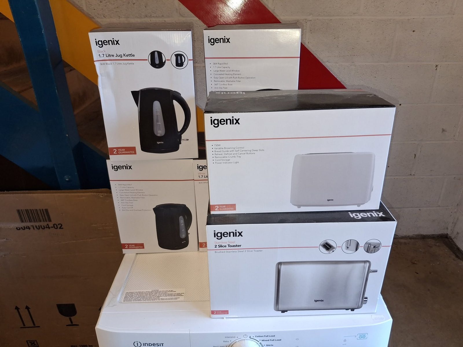 Igenix kettle and toaster boxes stacked on a washing machine